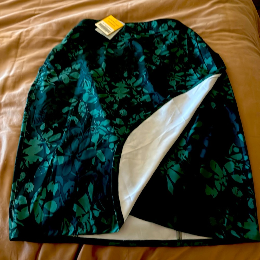 Brand new rip skirt. Never worn, beautiful camo floral print.